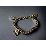 A 9ct Gold Charm Bracelet, with Heart Clasp & Safety Chain. All links individually hall marked, 14.