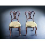 TWO VICTORIAN CARVED MAHOGANY CHIPPENDALE STYLE CHAIRS. WITH PADDED SEATS.