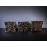 A COLLECTION OF THREE 19th CENTURY CARVED WOOD DECALS. 9 X 8CM