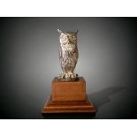 A Hallmarked sterling silver Owl figure, mounted on a wooden stepped plinth. Not filled. 137g silver