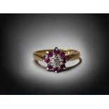 a ladies 9ct gold, Garnet and Diamond ring Size P