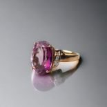 A 9ct gold ladies Amethyst sweep ring set, with Diamond chip shoulders Size O
