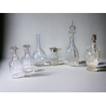 A COLLECTION OF 19TH CENTURY DECANTERS & EWERS.