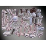 A LARGE COLLECTION OF PORCELAIN DOLL PARTS, INCLUDING LIMBS, TORSOS, EYES ETC - MANY SIGNED AND NAME