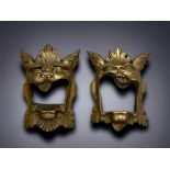 A LARGE PAIR OF VICTORIAN GOTHIC CAST BRASS DOOR MASKS. 36CM TALL.