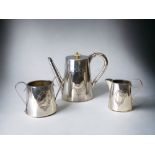 A VICTORIAN FATTORINI & SON SILVER PLATE TEASET. WITH MONOGRAMMED CARTOUCHES. TEAPOT HEIGHT - 18CM