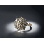 A 9ct gold ladies Diamond cluster ring. 2.5g Size M