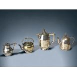 A COLLECTION OF FOUR 19TH CENTURY SILVER PLATE TEAPOTS.