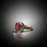 A 9ct gold ladies Ruby halo design statement ring. Size L