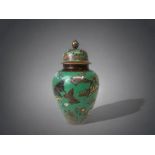 A 19TH CENTURY SMALL JAPANESE CLOISONNE VASE. MEIJI PERIOD. GREEN GROUND, WITH FINELY DETAILED BUTTE