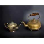 AN AMBER GLASS HANDLED COPPER TEAPOT. TOGETHER WITH A SILVER PLATE TEAPOT.