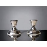 A Matched pair of 925 silver dwarf candlesticks. H/M. Height - 8cm
