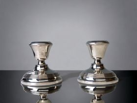 A Matched pair of 925 silver dwarf candlesticks. H/M. Height - 8cm