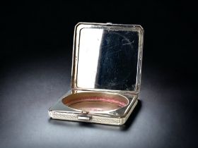 An Art Deco 925 silver ladies square compact with mirror. London 1932 hallmarks.