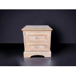 A TWO DRAWER BEDSIDE CABINET.