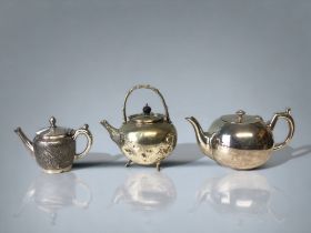 A COLLECTION OF THREE 19TH CENTURY SILVER PLATE TEAPOTS. INCLUDING A JAPANESE STYLE BATCHELORS