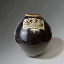 A LARGE CHINESE BROWN GLAZE MATABAN JAR. HEIGHT - 42CM