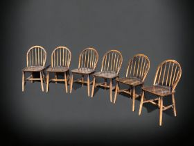 A SET OF SIX ERCOL STICK BACK WINDSOR DINING CHAIRS, TOGETHER WITH TWO SIMILAR CARVERS.