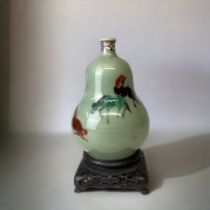 A CHINESE GOURD VASE. EARLY 20TH-CENTURY. CELADON GROUND, HAND PAINTED WITH POLYCHROME HORSES.