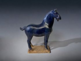 A CHINESE CERAMIC BLUE GLAZE TANG STYLE HORSE. HEIGHT - 27CM
