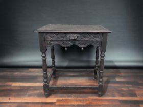 19TH CENTURY GOTHIC REVIVAL 'GREEN MAN' CARVED OAK SIDE TABLE.