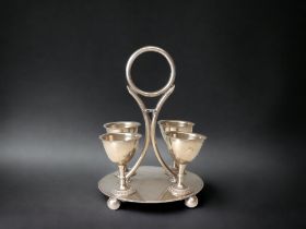 19TH CENTURY CHRISTOPHER DRESSER TYPE SILVER PLATE EGG CUP CRUET SET.