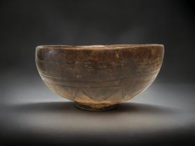 A 19TH CENTURY TUAREG PEOPLE CARVED WOODEN BOWL. CARVED PATTERNS TO THE OUTSIDE. 14 X 28CM AF