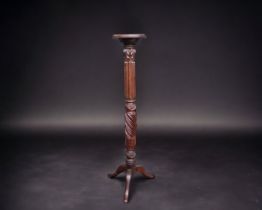 A VICTORIAN TRIPOD CARVED TORCHERE STAND.