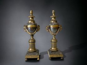 A PAIR OF 19TH CENTURY GRAND TOUR BRONZE CANDLESTICKS / CAMPANA. RAMS HEAD HANDLES LINKED WITH