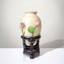 1882 CHRISTOPHER DRESSER FOR MINTON 'CHINESE TRIPOD' VASE. RELIEF DECORATED WITH PAINTED LILIES.