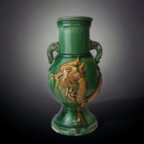 A LARGE CHINESE SANCAI GLAZED VASE. RELIEF DECORATED WITH A 5-CLAW DRAGON AND TWIN ELEPHANT HANDLES.