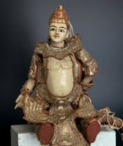 A BURMESE MARIONETTE PUPPET. CARVED WOODEN WITH ELABORATE DRESS. LENGTH - 47CM