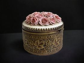 A CONTINENTAL TRINKET BOX. CIRCA 1920's. DECORATED METAL GRAPE VINE WITH RELIEF CERAMIC ROSES LID. 7