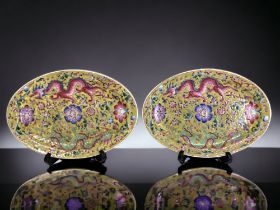 A PAIR OF CHINESE PORCELAIN OVAL DISHES. YELLOW GROUND, WITH ENAMELS PAINTED IN FAMILLE ROSE