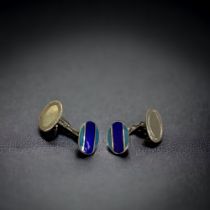 A PAIR OF STERLING SILVER & ENAMEL CUFF LINKS.