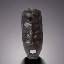 AN AFRICAN CARVED HARDWOOD MASK. POSSIBLY MAKONDE PEOPLE. 1ST HALF 20TH CENTURY. 46CM TALL