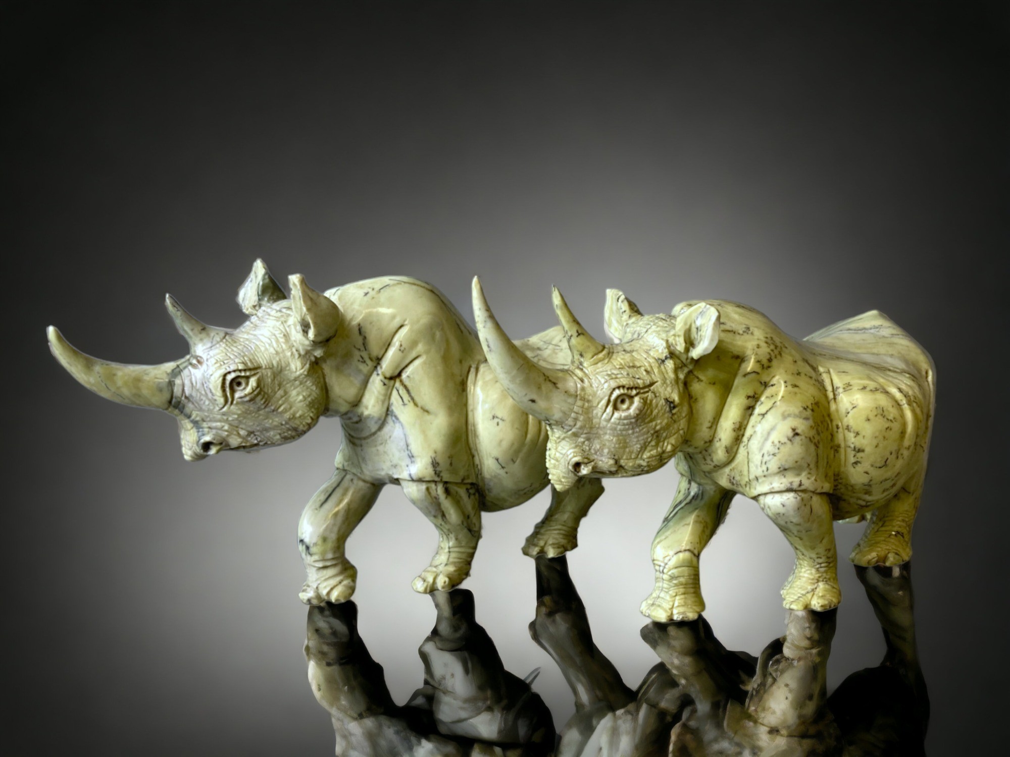 A large pair of Zimbabwean (Shona) people Butterjade Rhinoceros carved sculptures. 15 x 30cm - Image 2 of 5