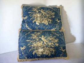 A PAIR OF 19TH CENTURY FRENCH BLOCK PRINTED CUSHIONS.