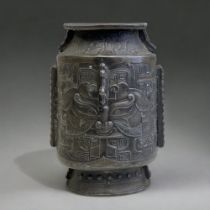 A CHINESE PEWTER ARCHAISTIC STYLE VASE. QING DYNASTY. DEPICTING TAOTIE MASKS TO BOTH SIDES, WITH