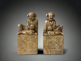 A LARGE PAIR OF CHINESE CARVED SOAPSTONE FIGURAL SEALS. 18 X 8CM AF