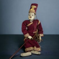 A CARVED WOODEN BURMESE MARIONETTE PUPPET. HAND MADE & PAINTED, WITH FINE QUALITY DRESS. LENGTH -