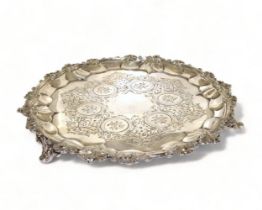 Silver H/M 3 leg salver with embossed decoration standing on scrolled feet 23cm diameter 333g