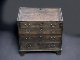 A GEORGE III OAK WRITING BUREAU. AF