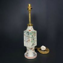 AN UNUSUAL JAPANESE KAKIEMON PORCELAIN VASE, CONVERTED TO A LAMP. A 'TWISTED' SQUARE BOY WITH A LONG