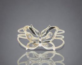 A ladies sterling silver Butterfly bangle.