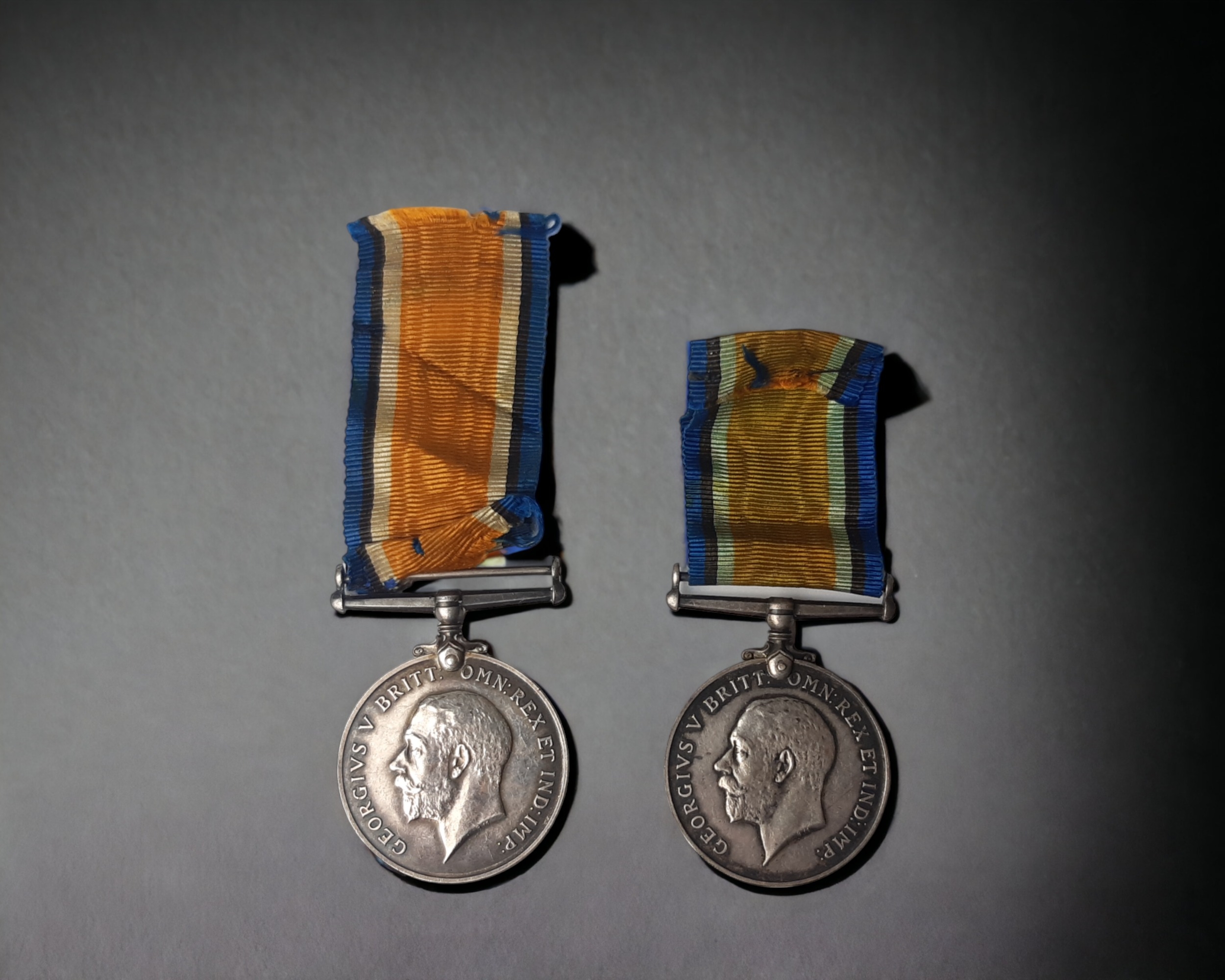 TWO WWI GEORGE V BRITISH WAR MEDALS. WITH RIBBONS. ONE NAMED 'DVR. T. SEAL. R.E.' THE OTHER