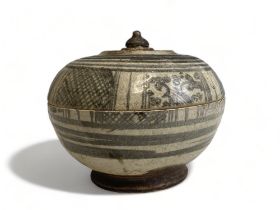 A Thai 'Sawankhalok' pottery lidded jar. 15th/16th Century. 11 x 14cm