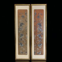 A pair of Chinese framed silk embroidered panels / sleeves? Coral ground silk sections with blue