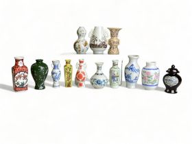 A COLLECTION OF 13 CHINESE AND JAPANESE MINITURE VASES