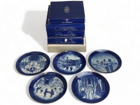 A collection of six Royal Copenhagen Christmas plates.